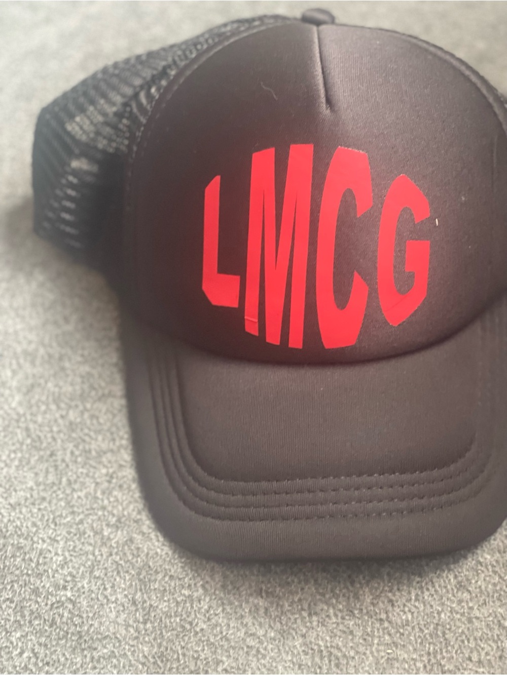 Black Trucker Hat with Red LMCG Logo